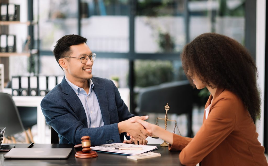 Franchise Lawyers discussing contract